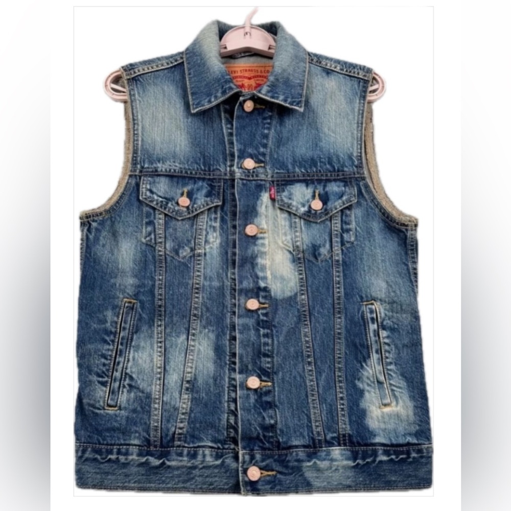 Levi’s Denim Trucker Sleeveless Distressed Jean Jacket
New without Tags
